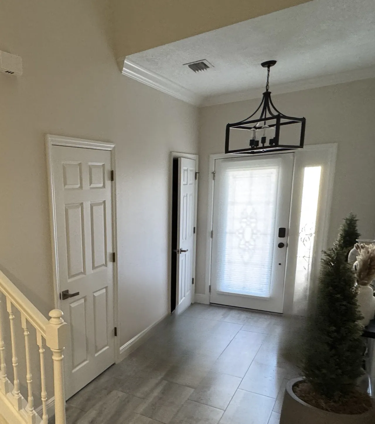 Before: entry hall with white six-panel doors
