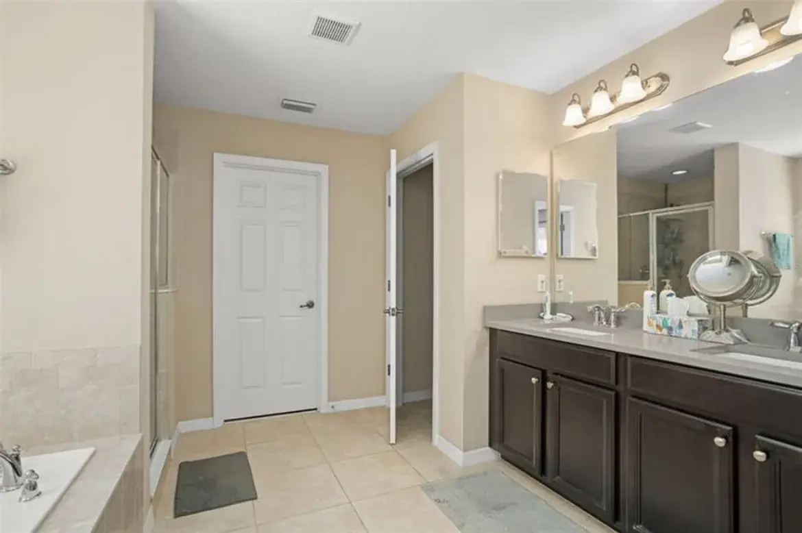 The original vanity and floor tile before the remodel